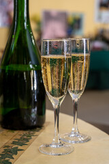 Pouring and tasting of dry sparkling wine brut, grand reserve, champagne in Ay-Champagne wine making village in Vallee de la Marne, , Champagne region, France