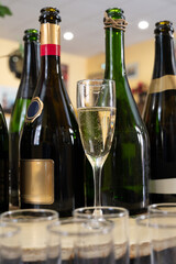 Pouring and tasting of dry sparkling wine brut, grand reserve, champagne in Ay-Champagne wine making village in Vallee de la Marne, , Champagne region, France