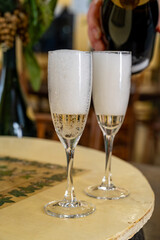 Pouring and tasting of dry sparkling wine brut, grand reserve, champagne in Ay-Champagne wine making village in Vallee de la Marne, , Champagne region, France