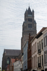 Medieval houses facades and rooftops and city tower with bells in the centre of Bruges, Flanders