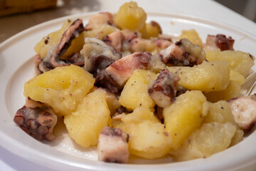 Tasty antipasti salad or starter seafood dish, grilled octopus sicilian style with potatoes served on fish market in Marsala, Sicily, street food in Italy