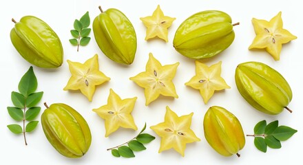 Fresh starfruit carambola whole and star-shaped cross-sections with green leaves on white background showing tropical fruit pattern