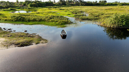 Isolated Canoe At Santo Amaro In Maranhao Brazil. Nature Landscape. Beautiful Rainforest. Isolated Canoe In Maranhao. Mangrove Scenery. Colored River. Native Village. Brazil Northeast.