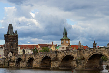 Fototapeta premium Scenic Prague cityscape with Old Town bridge Tower and Charles bridge over Vltava river, Czech Republic.