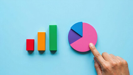 Colorful Bar Graph and Pie Chart Displaying Data Analysis and Statistics, Ideal for Business Insights and Presentation Visuals, on a Light Blue Surface