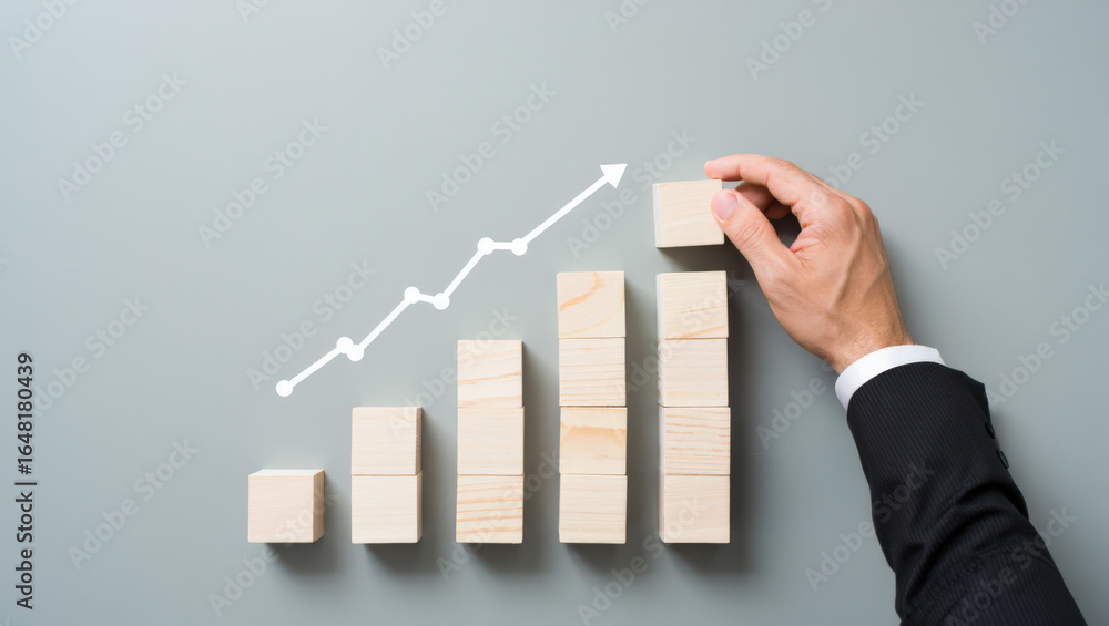 Poster strategic growth visualization a hand placing a wooden block on a rising bar graph with an upward ar