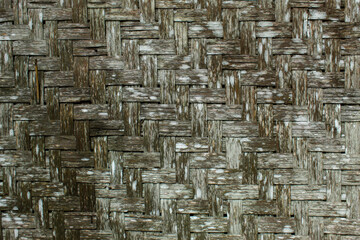 Traditional bamboo woven wall texture with dense natural patterns and clearly visible bamboo fiber...