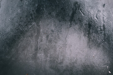 The texture and background of water droplets on the glass surface, forming a natural texture with a...
