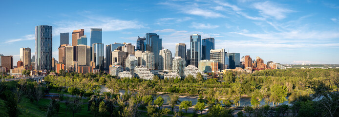 Calgary's skyline along the Bow River on a beautiful summer morning.