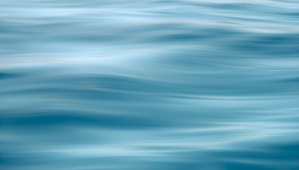 Naklejka premium Abstract close up of gentle flowing blue water with soft horizontal lines and subtle light reflections creating a serene and calming natural background texture