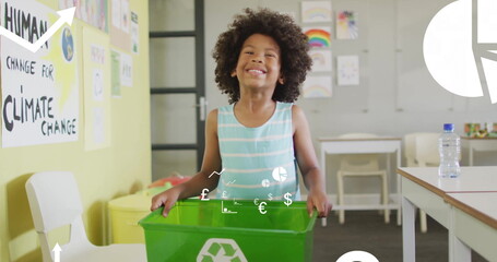 Standing child showcasing green recycling bin in school classroom, with climate awareness posters