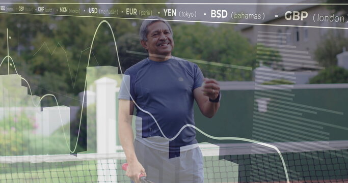 Senior man holding tennis racket beside net, viewing holograms with currency codes in tennis court