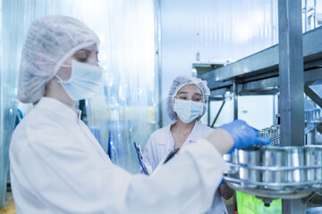 Food and manufacturing researchers oversee seafood production lines in tightly controlled factories...