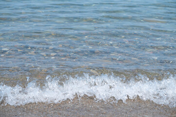 Lake Erie clear water with stones, selective focus background image, of clear water lake, vacation...