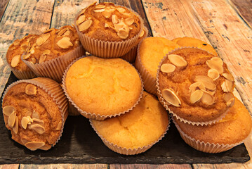 Delicious cocoa muffins with a silky milk chocolate glaze and crushed hazelnuts