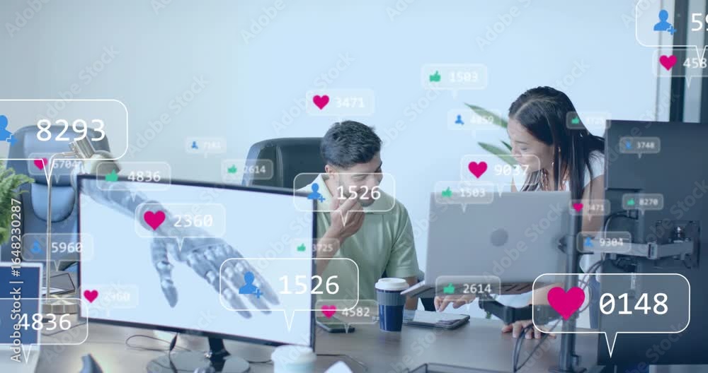 Poster coworkers conversing at technology desk with social metrics updating near robotic arm for insights