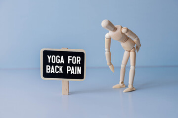 Rear view of a toned young woman with back pain