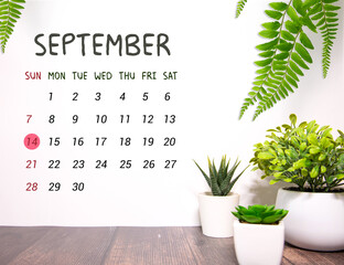 Wooden calendar organizer with date September 14