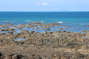 Rugged coastal landscape with rocks and the ocean at Hay Point beach in Queensland, Australia