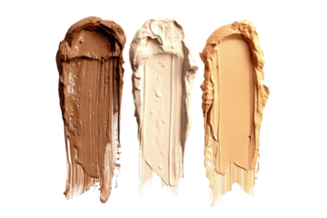 Three swaths of creamy makeup foundation in varying light beige, tan, and medium brown tones