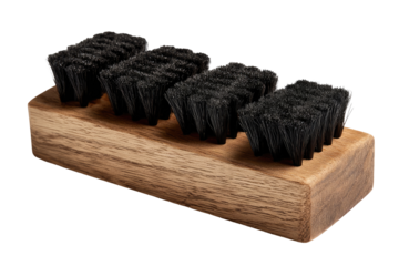 Wooden shoe brush set. Three pairs of dark bristle shoe brushes mounted on a light brown wooden block