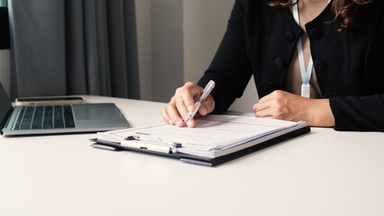 Businesswoman employer holding resume, recruiting, planning, evaluating and reviewing resume of job applicant, recruiting new employees, recruitment concept