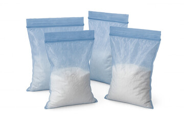 Transparent plastic zipper bags filled with white powdery substance, arranged against clear background