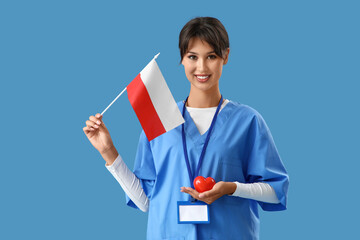 Female doctor with flag of Poland and heart on blue background