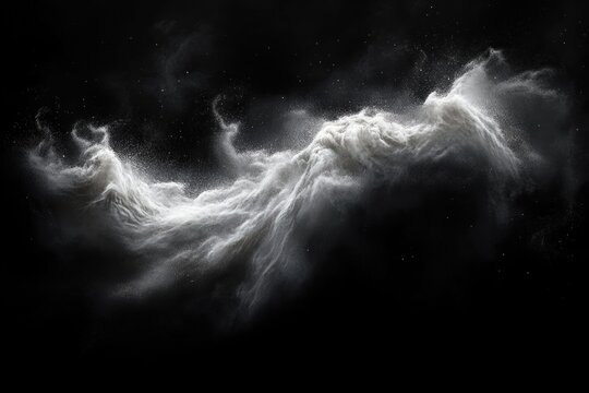 Dynamic cloud of white powder or dust particles swirling and expanding against a black background with a sense of motion and energy