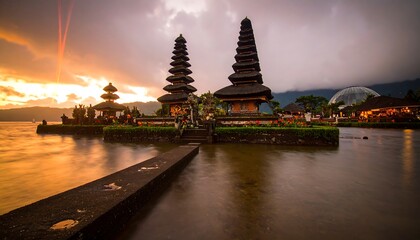 Sunrise over temple on lake