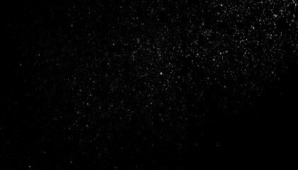 Abstract black background with scattered white particles