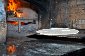 turkish chef working in the oven