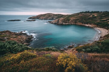Obraz premium Coastal bay scene with dramatic sky and varied terrain