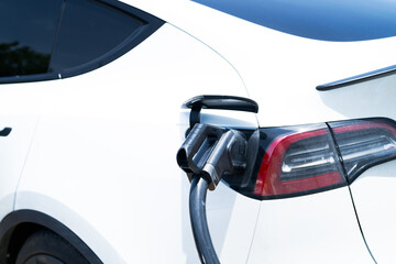 Electric vehicle charging station. Sustainable transport infrastructure with clean energy battery...