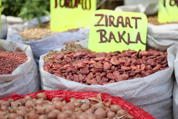 Colorful variety of beans at local market stall in daylight