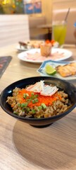 Crab fat fried rice topped with shrimp eggs, shredded crab sticks and chopped Japanese green onions.