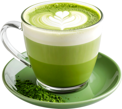 A clear glass mug filled with a layered matcha latte, featuring latte art, sits atop a green saucer with matcha powder spilled beside it.