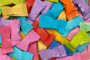 Vibrant Assorted Wrapped Candies in Colorful Wrappers - A Sweet and Playful Showcase of...