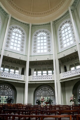 Bahai house of worship an interior vertical view showing seating below, arched windows and up to...