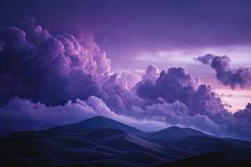 Dramatic purple clouds over dark dunes at sunset