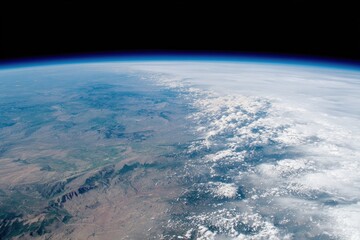 Earth's curve, landmasses, and clouds from space