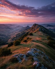 Naklejka premium Mountain vista at sunrise. Colorful sunrise over rolling hills