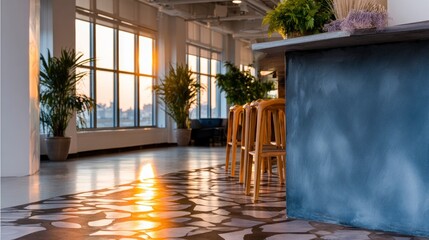 Fototapeta premium Modern office interior with large windows potted plants and bar stools during sunset