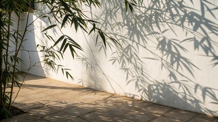 Bamboo shadows cast on a wall, creating an artistic interplay of light and texture.
