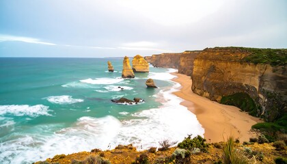 Coastal scene with dramatic rock formations, turquoise water, and sandy beach