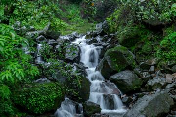 A waterfall during the monsoons near Pune India. Monsoon is the annual rainy season in India from June to September.