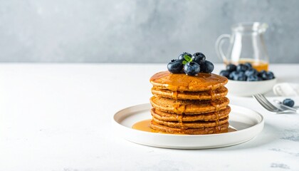 Pancakes with Blueberries and Maple Syrup, a delightful breakfast still life, A stack of homemade...