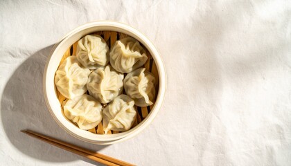 Steamed Dumplings in Bamboo Basket on White Cloth, Delicious Dumplings Presented in Bamboo Steamer...