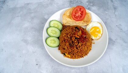 Nasi Goreng: A Flavorful Indonesian Fried Rice Dish with Fresh Accompaniments, Vibrant Indonesian...