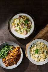 Farfalle four cheese and tagliatelle mushroom bolognese, bright rustic overhead composition